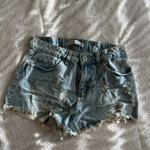 Distressed denim shorts.